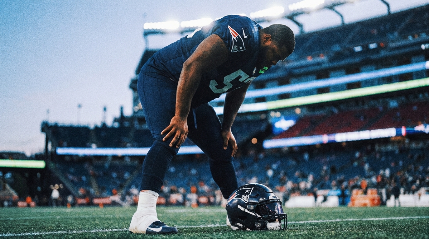 Patriots defensive lineman stretching on sideline